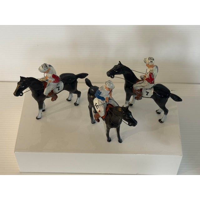 A charming vintage American set of three cast metal racehorse and jockey figures, each marked Made in U.S.A. These mid-...