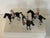 A charming vintage American set of three cast metal racehorse and jockey figures, each marked Made in U.S.A. These mid-...