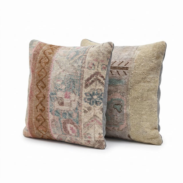 This 20'' x 20'' pillow cover set was made from authentic Turkish rug pieces — sun faded pastel Oushak florals in cream...
