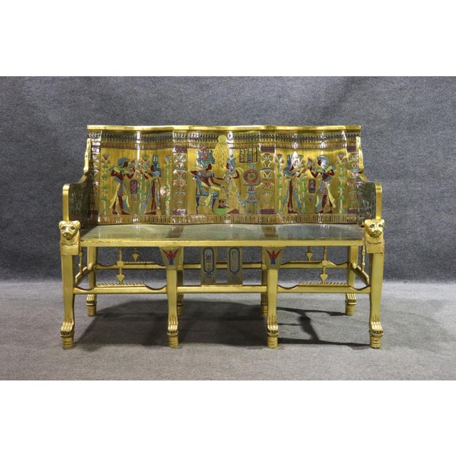 This striking Egyptian Revival–style gilded figural bench is a rare and dramatic statement piece, inspired by the grandeur...