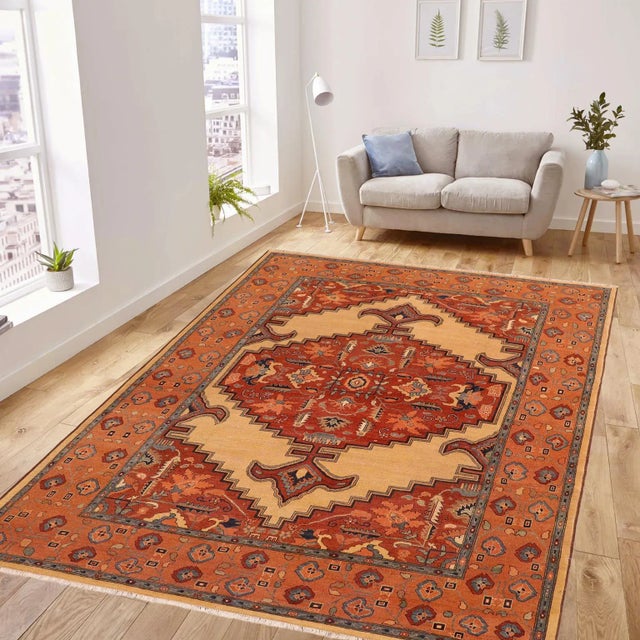 An exhilarating oriental rug with distinctive motifs and wide-ranging pallet of warm colors, this antique vintage...