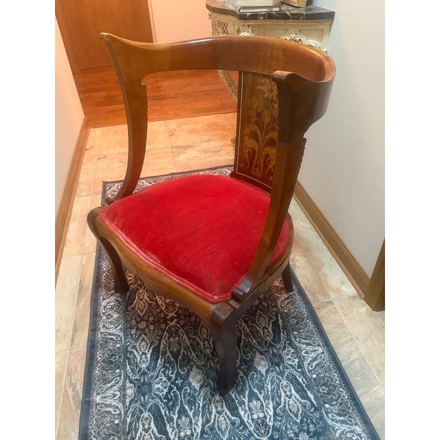 Elevate your space with this striking 19th-century European parlor chair, blending classic Biedermeier silhouette with...