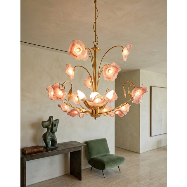 An exquisite and rare 1970s Italian chandelier featuring hand-blown Murano glass shades shaped like delicate blooming...