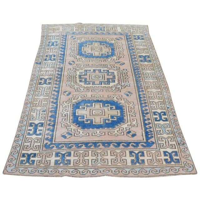 Hand-knotted with care using traditional rug-making techniques, this wool rug blends timeless craftsmanship with a modern...