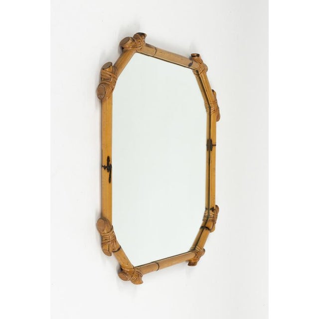 Midcentury amazing octagonal wall mirror in rattan and bamboo in the style of Vivai del Sud. Made in Italy in the 1970s.