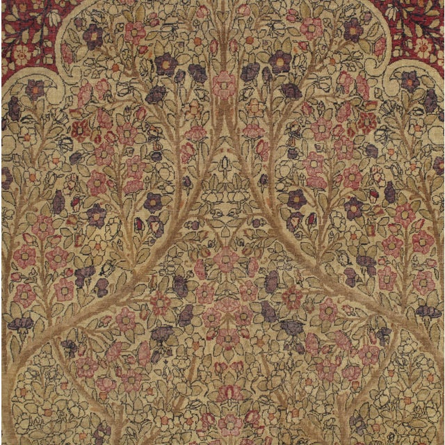 This master crafted Persian Laver Kirman carpet exemplifies the profound understanding of the artistic principles of...