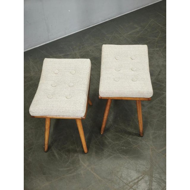 A beautifully restored pair of Mid-Century Modern stools produced in Czechoslovakia during the 1960s. These elegant stools...