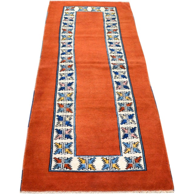 Hand-knotted with care using traditional rug-making techniques, this wool rug blends timeless craftsmanship with a modern...