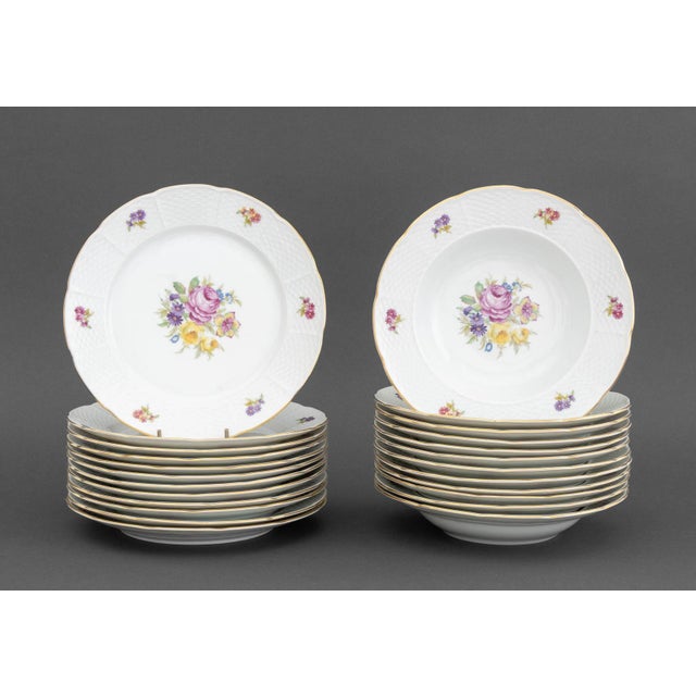 Thun Bohemia Porcelain Dinner Service for Twelve, floral motif, gilt rim, each marked "TK / Thun / Czechoslovakia"...