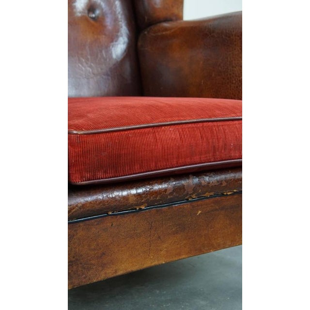 Vintage Leather Wing Chair with Red Corduroy Seat Cushion For Sale - Image 10 of 14