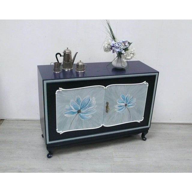 Chippendale-style sideboard, 2 doors, 1 removable shelf, refinished in a warm midnight blue, and the doors adorned with...