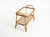 A beautiful, small, original Italian bamboo side table from the 1960s, featuring a lower shelf. The top retains its...