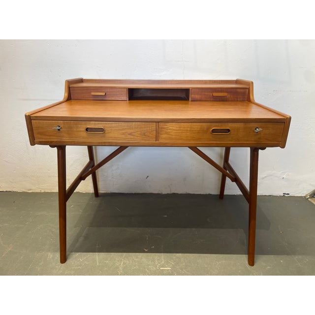 Beautiful, elegant, and delicate teak desk. Both keys are included. Labels are also present, as shown in the photos. The...