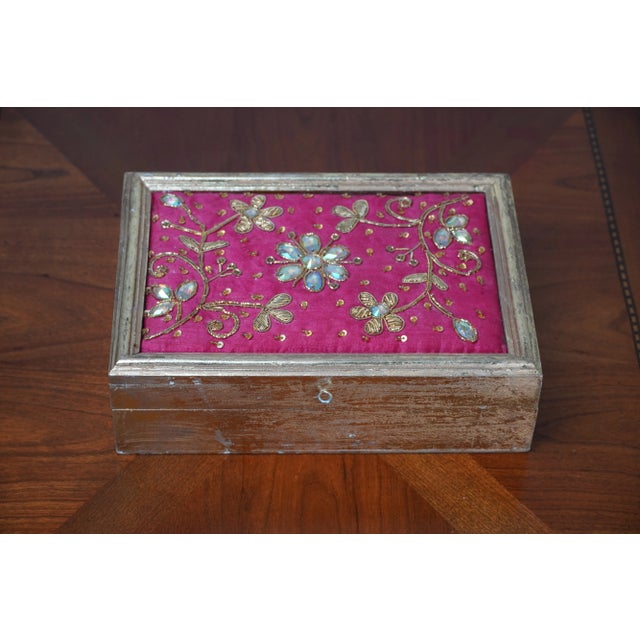 This vintage decorative box combines rich craftsmanship with vibrant design, possibly originating from India and...