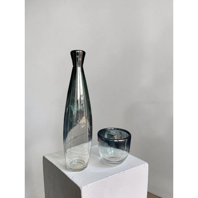 Elegant Swedish art glass set designed by Bengt Orup for Johansfors Glassworks, Sweden, 1960s. This refined two-piece...