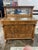 This tiger oak sideboard with beveled mirror backboard dates to the early 20th century, approximately 1910-1920. It...
