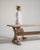 A classic trestle dining table showcasing solid oak construction and enduring craftsmanship. The form remains timeless and...