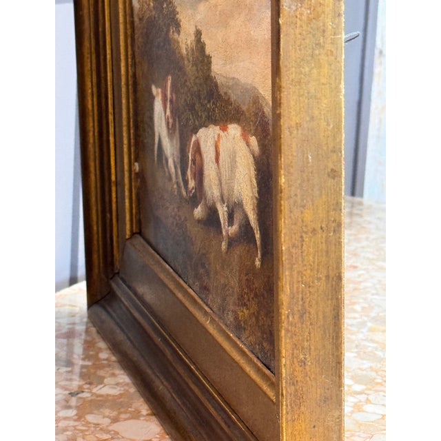 Charming oil on board painting depicting two Spaniels in a wooded landscape, rendered with fine detail and warmth. The...