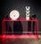 Our neon pink console table floats in a room without permanent visual seating. In a single continuous turn, thick-cut...