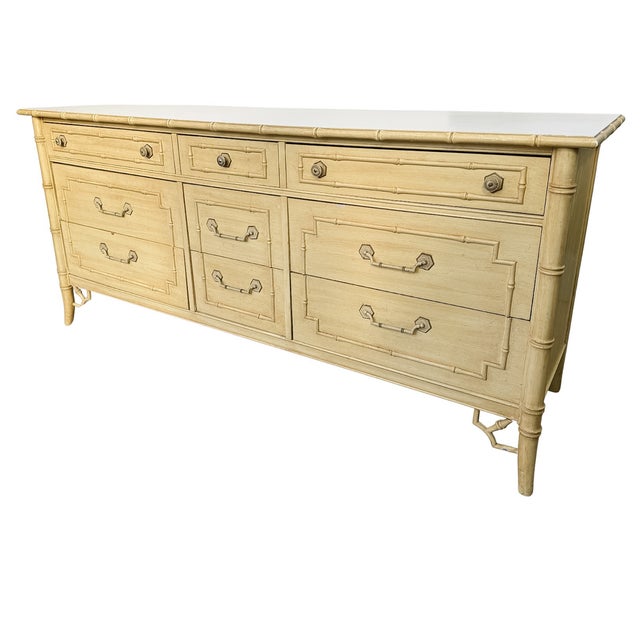 A nine-drawer dresser from the Thomasville "Allegro" collection in a creamy, light yellow finish. Iconic faux bamboo...