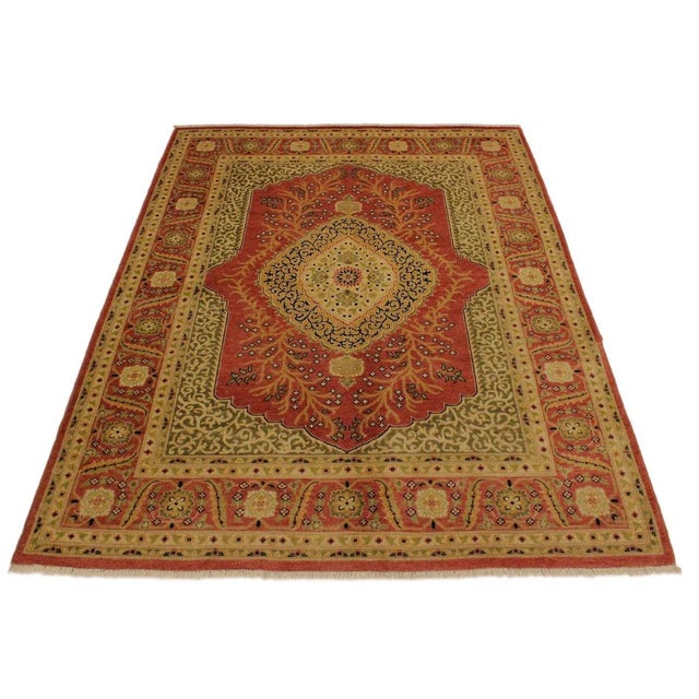 Designed with a mesmerizing intricate traditional motif this glorious hand knotted rug is a masterpiece that will fill any...