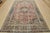 An authentic vintage traditional Mashad rug hand-knotted with fine wool and natural dyes. This oriental rug features a...