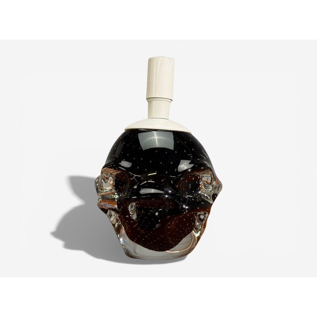 Kosta, Swedish Mid-Century Modern, Small Table Lamp, Black Glass, Sweden, 1950s A single black glass table lamp designed...