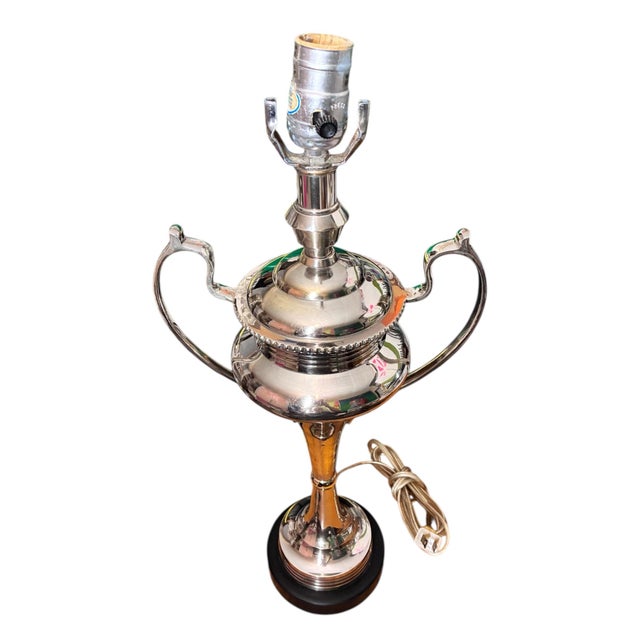 Add a touch of timeless sophistication to your space with this striking pair of vintage silver/chrome urn lamps. Styled...