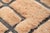 Architectural precision meets warm, earthy texture. This hand-knotted Moroccan rug features a sophisticated fragmented...