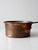 This antique copper saucepan dates to the late 19th to early 20th century and features a hand-worked copper body with a...