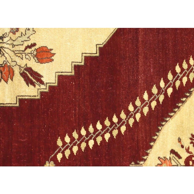 Handwoven wool-on-wool Oushak rug from vintage Turkey, measuring 5'7" x 7'. Originating from the storied weaving tradition...