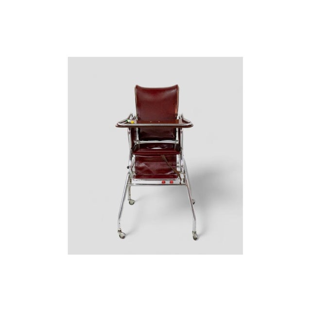 This charming 1970s vintage high chair in burgundy leather is a true retro piece, perfect for adding character to a...