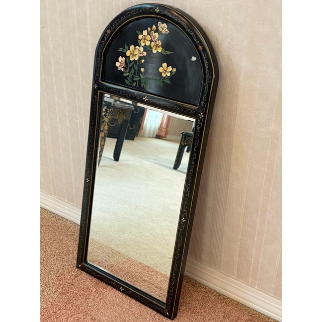 1960s-70s black lacquered/carved painted arched floral wall mirror. Excellent condition. Measures 36" x 16" including frame.