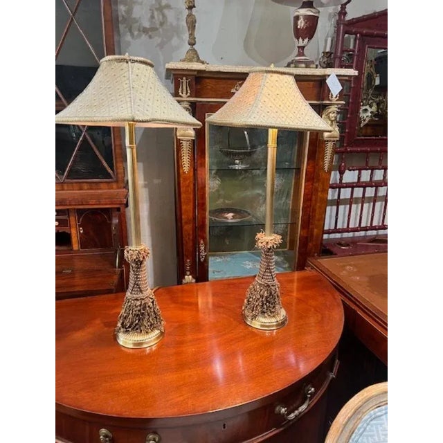 Add a touch of mid-century modern charm to your space with this beautiful table lamp from Raymond Waites. The lamp...