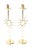 These fabulous vintage pair of polished brass candlesticks are in the style of the Italian master; Piero Fornasetti. His...