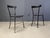 Set of 4 italian dining chairs consisting of black metal frames with black leather upholstery both on the seats and...