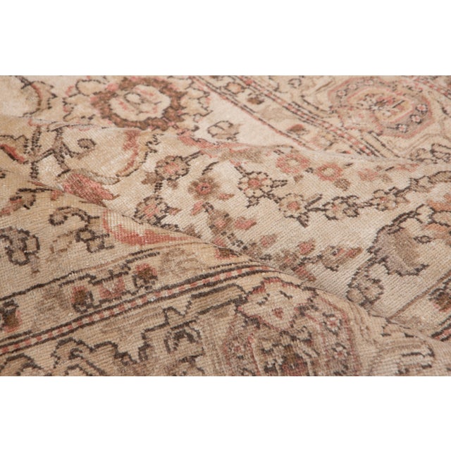 This exquisite Antique Persian Tabriz rug (circa 1920s) embodies the elegance and craftsmanship for which the renowned...