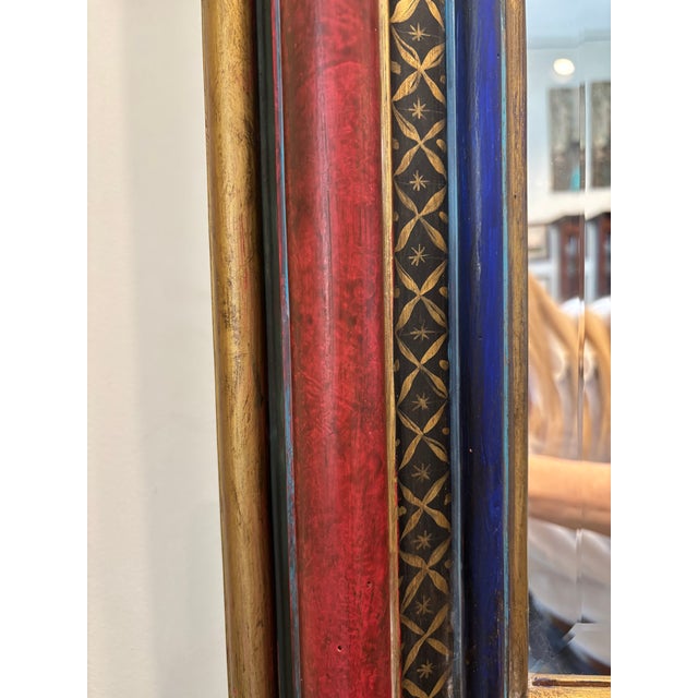 Striking decorative wall mirror from historic Chicago lake-front home featuring hand-painted frame in rich red, deep blue...
