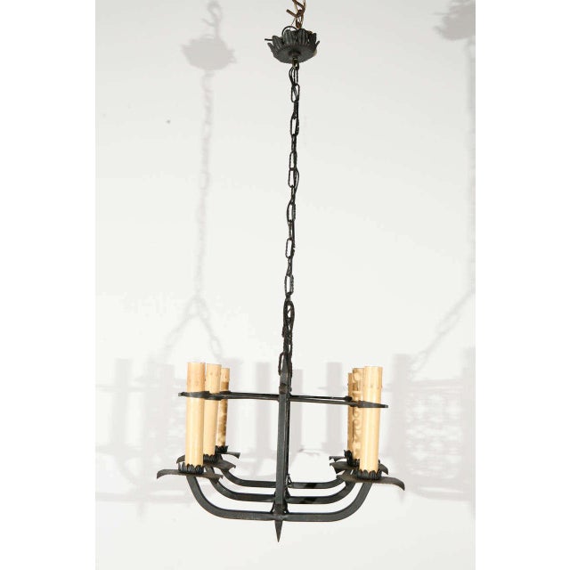 Italian fixture with iron cloverleaf designed details Newly wired for six candelabra sockets; each bulb takes up to 65 watts.