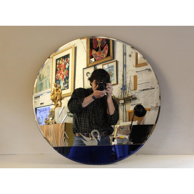 A gorgeous and well-preserved art deco wall mirror, designed by Donnelly-Kelley and manufactured by the Mirror...