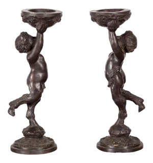 Greco-Roman Style Bronze Candle Holders Depicting Young Satyrs Holding Vessels - A Pair