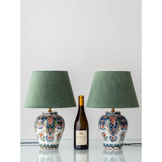 This striking pair of vintage table lamps brings together centuries-old Dutch ceramic craftsmanship and contemporary...