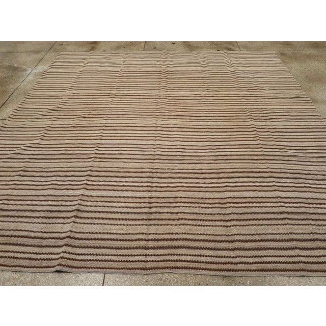 A vintage Turkish flatweave Kilim square room size carpet handmade during the mid-20th century. Measures: 10' 5" x 10' 7"