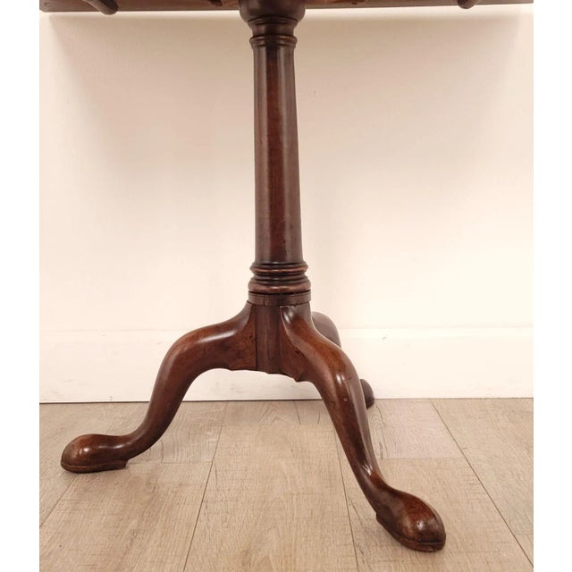 A George III tilt top mahogany rectangular tea table, circa 1790.