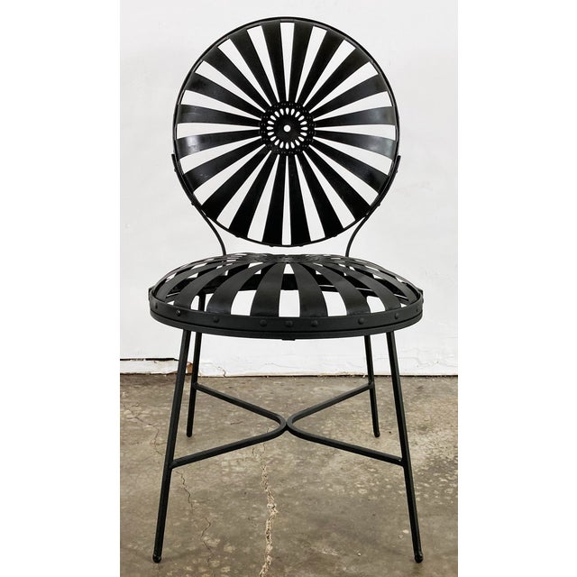 Iconic antique iron sunburst metal garden chairs also referred to as "pinwheel spring" chairs, "Casablanca" or "Grey...