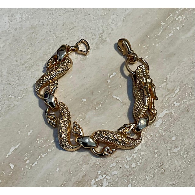 This vintage hand-carved rose gold toned dragon bracelet brings bold Asian-inspired artistry to a statement link design....