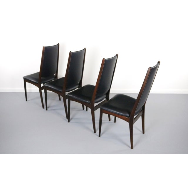 About the Rosewood Danish Modern Dining Chairs - A Set of 4 This set of 4 Danish Modern Dining Chairs in brilliant...