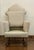 This small scale, antique wingback chair has bobbin turned front legs and risers with splayed back legs. Beautiful and...