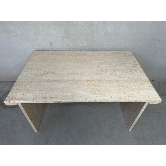 Vintage coffee table or side table. 1970s. Travertine. In good condition. Height: 40cm. Width: 90cm. Depth: 57cm. A small...