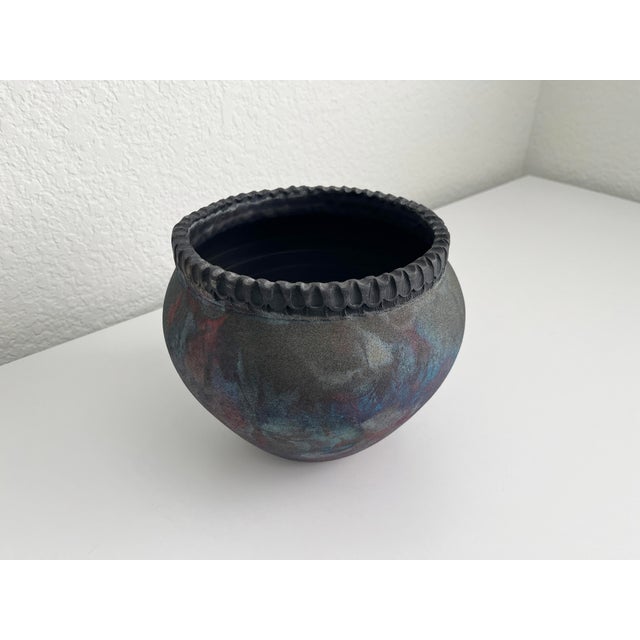 Contemporary artisan raku pottery vase with deep multicolor organic pattern and slight iridescence to the finish. Features...